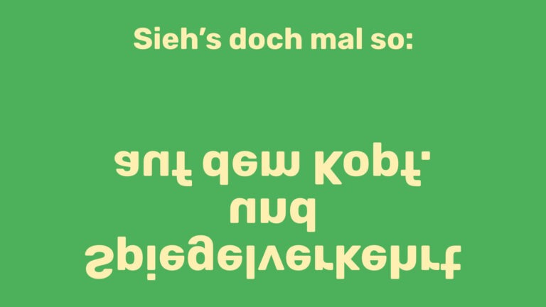 Postkartenmotiv mit dem Text "Sieh's doch mal so: spiegelverkehrt und auf dem Kopf."
