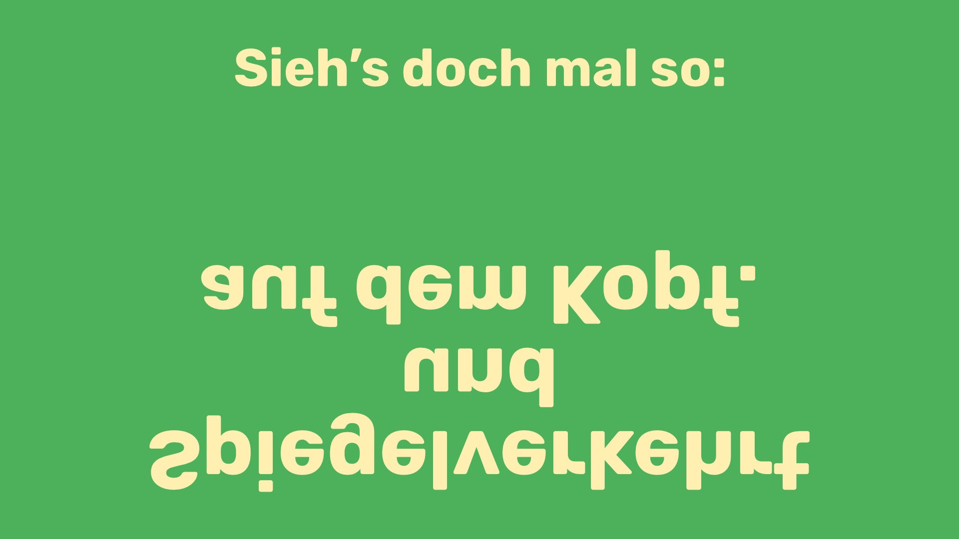 Postkartenmotiv mit dem Text "Sieh's doch mal so: spiegelverkehrt und auf dem Kopf."